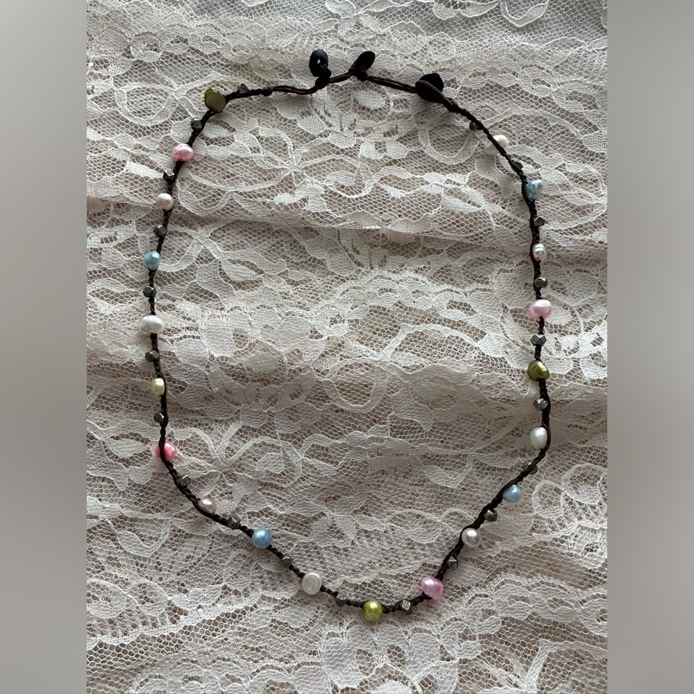 Necklace made with colored freshwater pearls? Knotted onto a cord